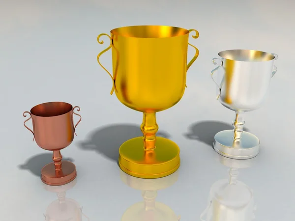 Gold silver and bronze cups for winners — Stock Photo, Image