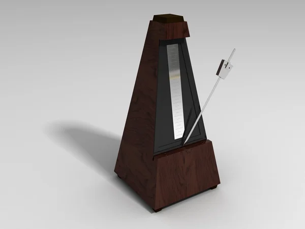 Wooden metronome on a white surface — Zdjęcie stockowe