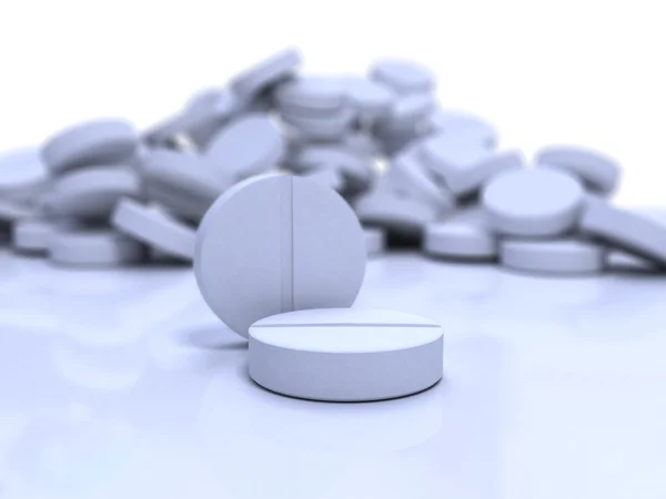 Close-up medical pills on blue surface — Zdjęcie stockowe