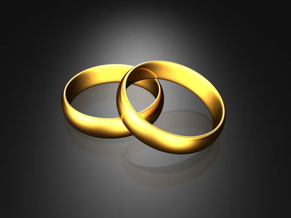 Zlaté snubní prsteny na černém pozadí — Stock fotografie