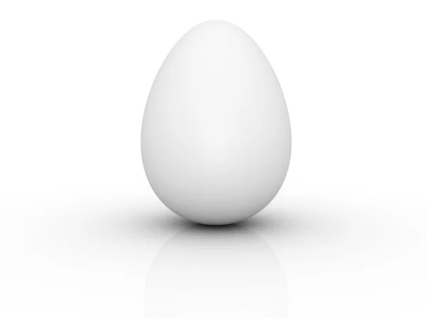 Белое яйцо на белой поверхности — стоковое фото