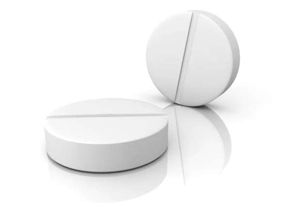 Due pillole mediche bianche su sfondo bianco — Foto Stock