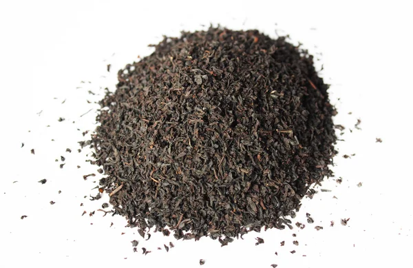 The pile of the dry tea leaves on white background — Stock Photo, Image