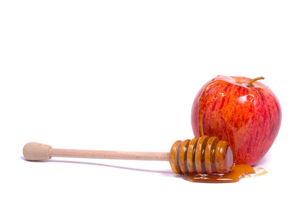 Яблоко с медом — стоковое фото