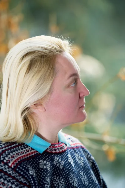 stock image Mature woman portrait near window