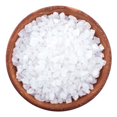 Wooden bowl full of sea salt over white clipart