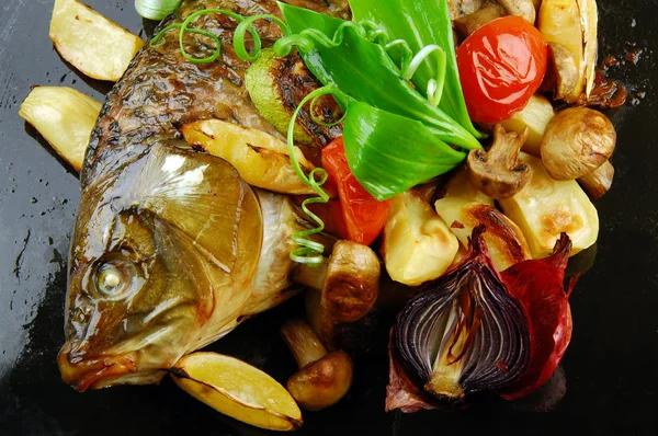 stock image Baked fish with vegetables