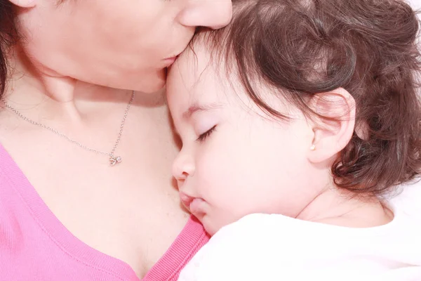 Delighted young mother taking care of her adorable baby at home — Stock Photo, Image