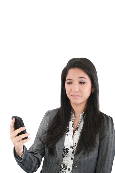 Portrait of angry female looking at cellphone, isolated on white — Stock Photo, Image
