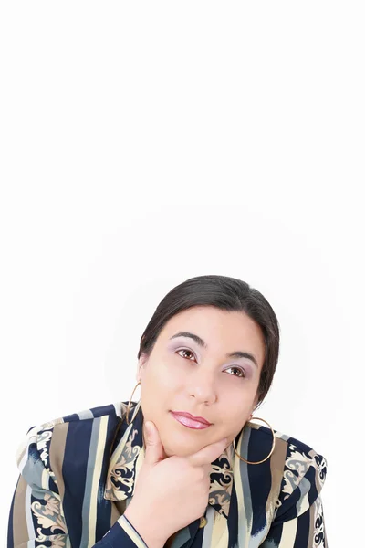 Nachdenkliche Frau blickt isoliert über weißem Hintergrund auf — Stockfoto