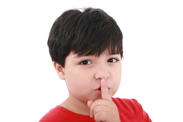 Shh. secret - Young boy with his finger over his mouth — Stock Photo, Image