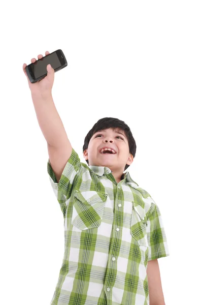 Boy holding up cellular phone and smiling — Stock Photo, Image