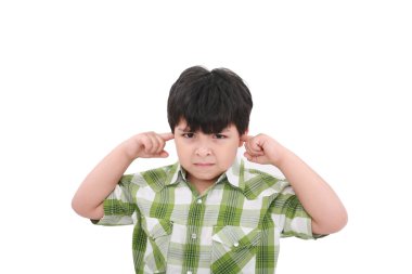 Photo of a boy with his fingers in his ears. clipart