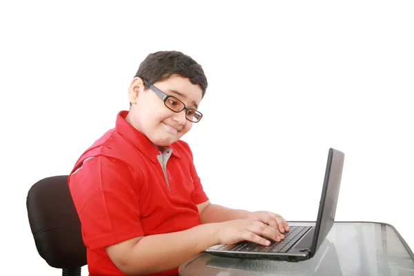 Young boy with computer isolated on white — Stock Photo, Image