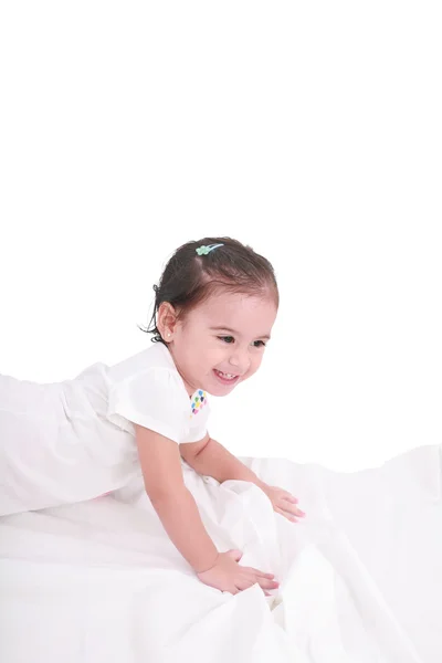 Cute little girl on the bed at home — Stock Photo, Image