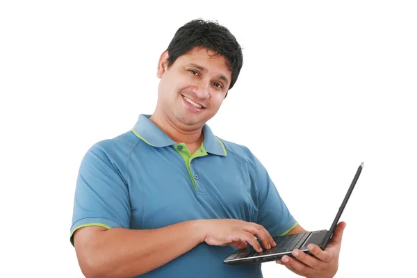 Jovem feliz com computador portátil - isolado em branco — Fotografia de Stock