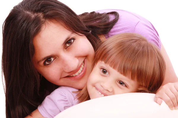 Mother and daughter posing happily in bed — Stock Photo, Image