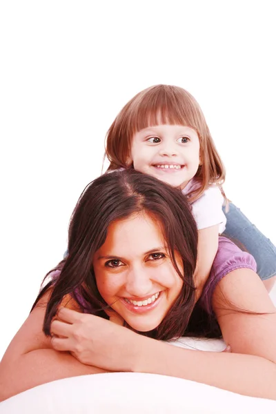 Mom and her little girl playing on pillow — Stock Photo, Image