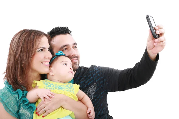 Primer plano de la familia feliz sonriendo sobre fondo blanco tomando sel —  Fotos de Stock