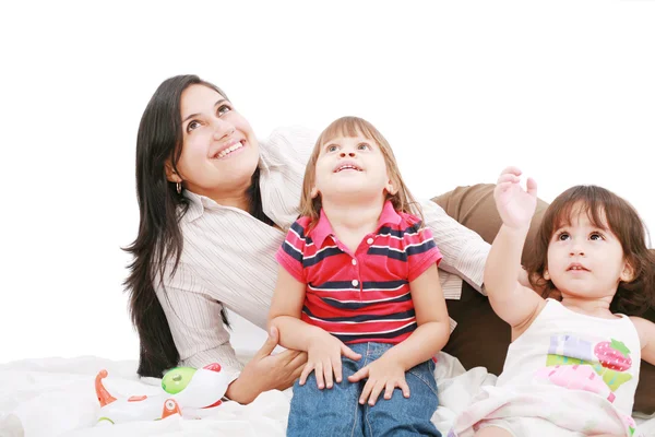 Happy caucasian mother and two daughter playing and looking up — Stock Photo, Image