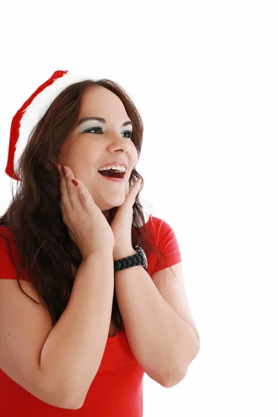 Verrast Kerstmis vrouw dragen een kerstmuts glimlachend geïsoleerde o — Stockfoto
