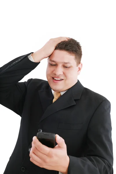 Een jonge knappe zakenman die op zoek bezorgd zijn cellphone over — Stockfoto