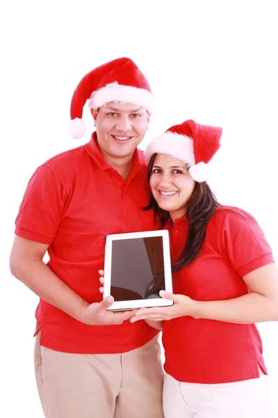 Casal desfrutando de seu novo touchpad no Natal — Fotografia de Stock