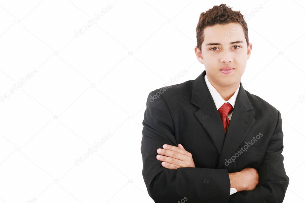 Young business man standing against the wall with crossed arms