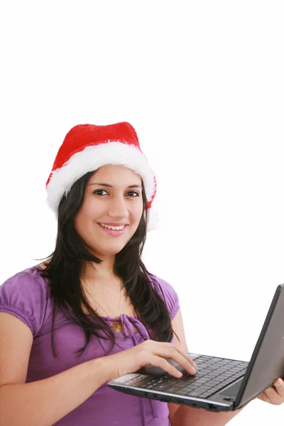 Beautiful business woman is working in office in santa claus hat — Stock Photo, Image