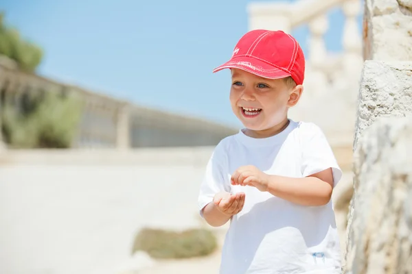 Portrait of cute boy in a red cap — Stock Photo, Image