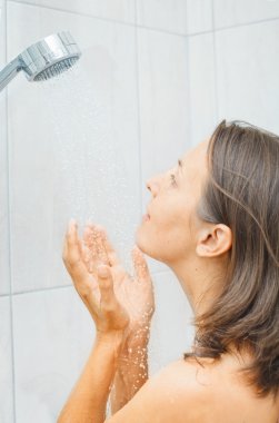 Beautiful woman in shower clipart