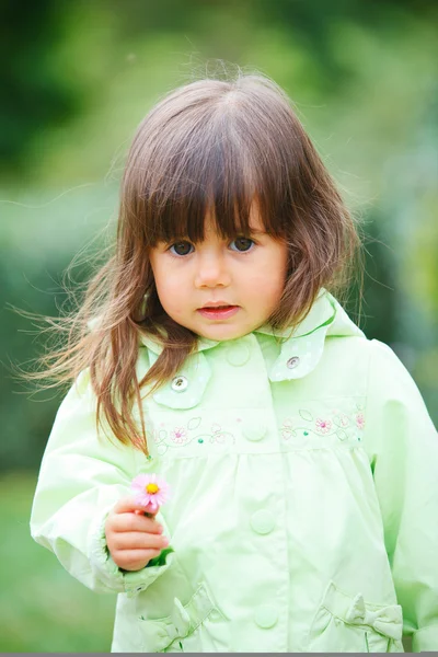 Little girl in red making funny face. — Stock Photo, Image
