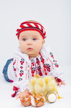 Little Girl With Easter Eggs And Baby Chickens clipart