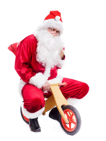 Zdjęcie szczęśliwy santa Claus na rowerze — Zdjęcie stockowe
