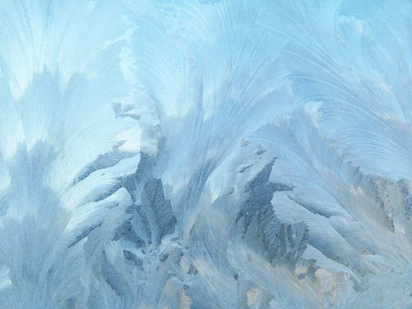 Patterns of the frost on glass in window — Stock Photo, Image