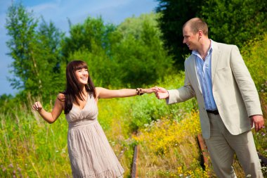 Romantic walk along the railway clipart