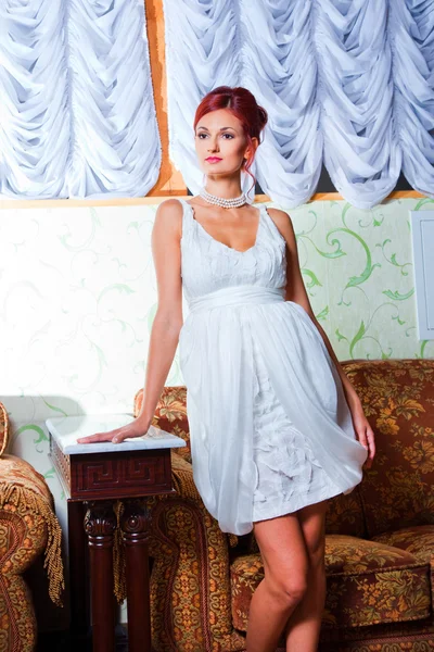 Glamour woman in vintage hall interior — Stock Photo, Image