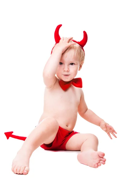 Kid in red suit of tempting devil — Stock Photo, Image