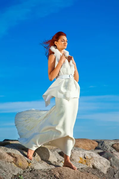 stock image Beautiful woman in white on seacoast