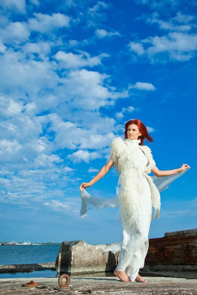 stock image Beautiful woman in white on seacoast