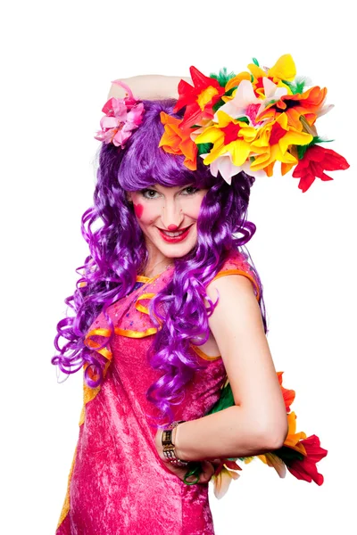 Женщина-клоун с красочными цветами — стоковое фото