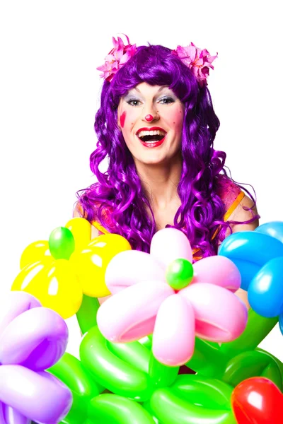 Female clown with colorful balloon flowers — Stock Photo, Image