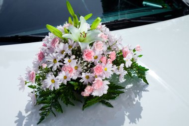 Bouquet on the wedding car clipart