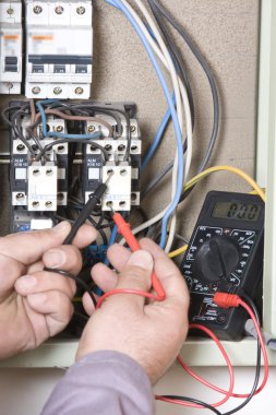 Electrical inspector reading power output clipart