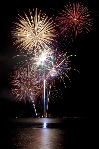 stock image Fireworks with lake reflection