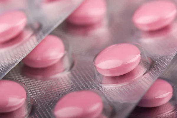 Рожеві таблетки в пакеті Ліцензійні Стокові Фото