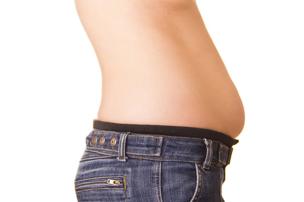 Ligeiramente recuperado a mulher em jeans em um fundo branco — Fotografia de Stock