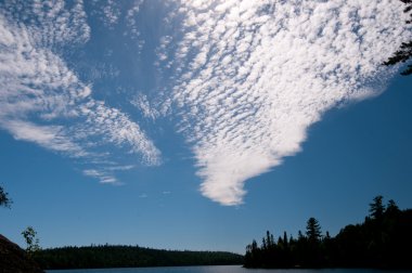 Clouds and Silhouettes in the North Woods clipart