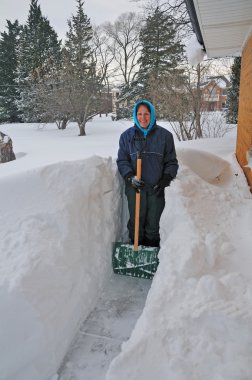 Shoveling out after a Winter Snow Storm clipart