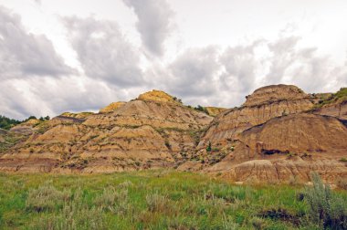 Storm clouds over the Badlands clipart